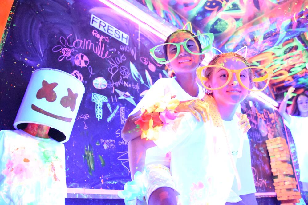 Glowing neon canvas paintings made at the party