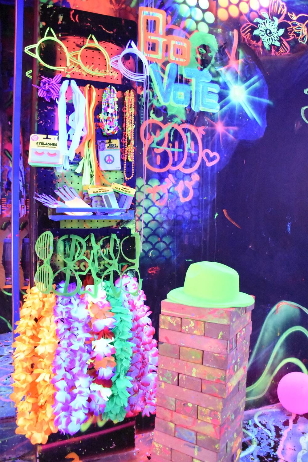 Glowing neon artwork on the blacklight room walls